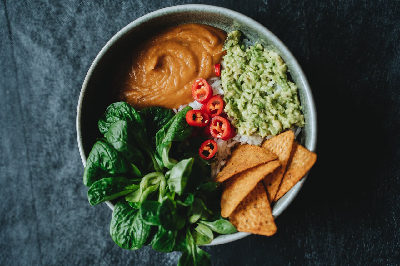 about-us Delicious vegan bowl featuring avocado, rice, and fresh greens perfect for a healthy meal.